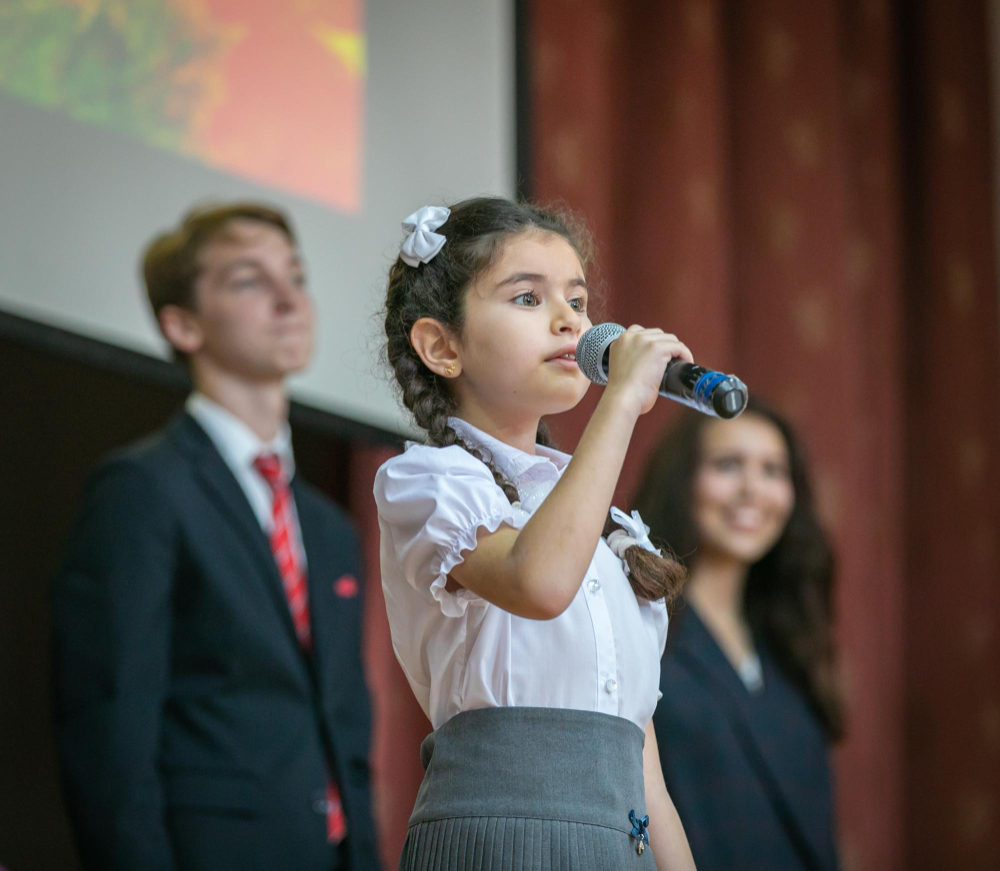 kid performing on stage